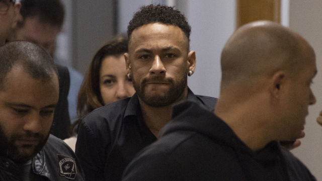 TOPSHOT - Brazil's star striker Neymar leaves a Police Station after giving a statement to police for posting intimate WhatsApp messages with Najila Trindade Mendes de Souza, who has accused of rape, on social media, at the Internet Crime Special Police Unit in Rio de Janeiro, Brazil on June 6, 2019.