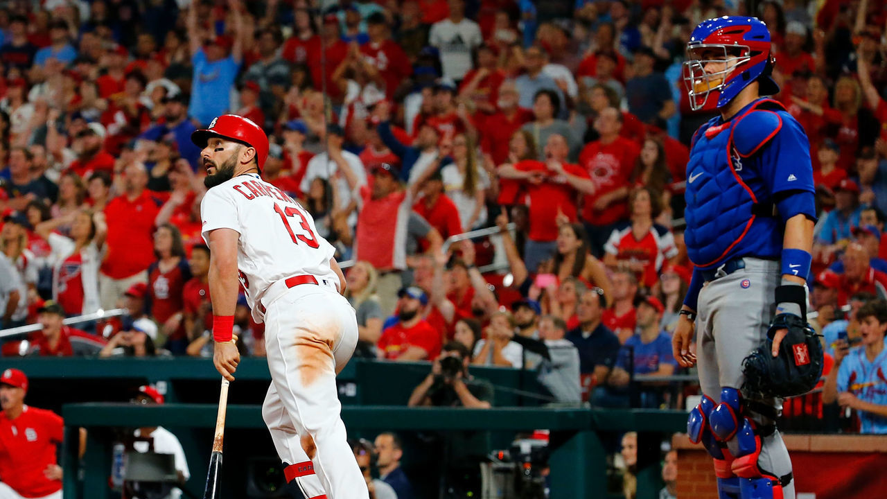 ST LOUIS, MO - MAY 31: Matt Carpenter #13 of the St. Louis Cardinals hits a walk-off single as Victor Caratini #7 of the Chicago Cubs looks on in the tenth inning at Busch Stadium on May 31, 2019 in St Louis, Missouri.
