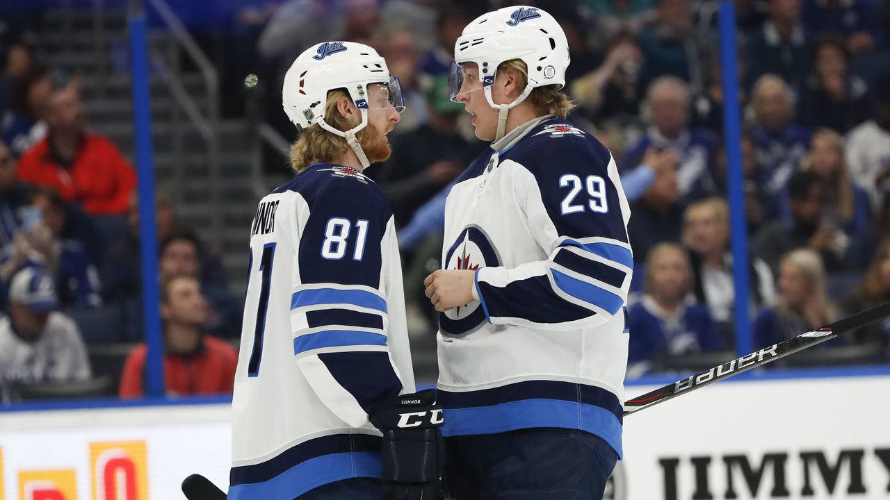 TAMPA, FL - MARCH 05: Winnipeg Jets left wing Kyle Connor (81) and Winnipeg Jets right wing Patrik Laine (29) talk during the NHL game between the Winnipeg Jets and Tampa Bay Lightning on March 05, 2019 at Amalie Arena in Tampa, FL.