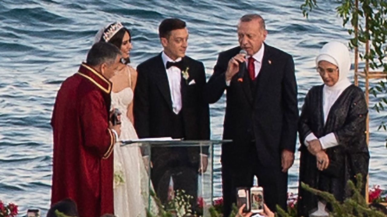 Arsenal's German midfielder Mesut Ozil (3rd L) and his fiance Amine Gulse (2nd L) stand next to Turkish President Recep Tayyip Erdogan (C) and his wife Emine Erdogan (2nd R) during their wedding ceremony at the Four Seasons Bosphorus Hotel in Istanbul, Turkey, on June 7, 2019.