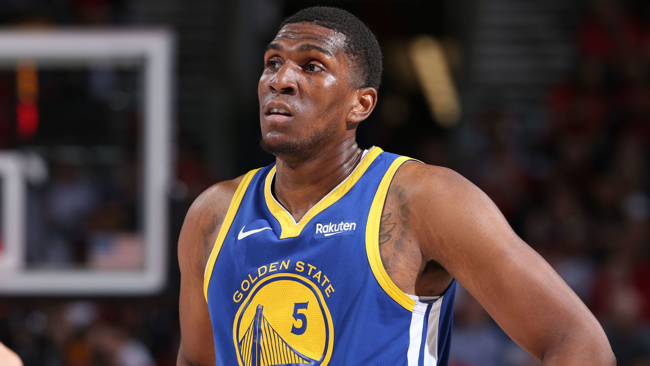 PORTLAND, OR - MAY 20: Kevon Looney #5 of the Golden State Warriors looks on during Game Four of the Western Conference Finals against the Portland Trail Blazers on May 20, 2019 at the Moda Center in Portland, Oregon. NOTE TO USER: User expressly acknowledges and agrees that, by downloading and/or using this photograph, user is consenting to the terms and conditions of the Getty Images License Agreement. Mandatory Copyright Notice: Copyright 2019 NBAE