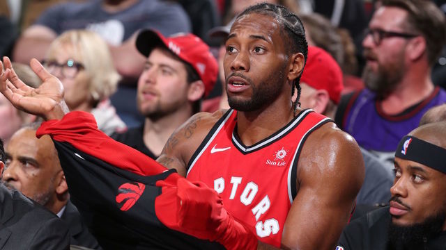 PORTLAND, OR - DECEMBER 14: Kawhi Leonard #2 of the Toronto Raptors seen on the bench during the game against the Portland Trail Blazers on December 14, 2018 at the Moda Center Arena in Portland, Oregon. Mandatory Copyright Notice: Copyright 2018 NBAE