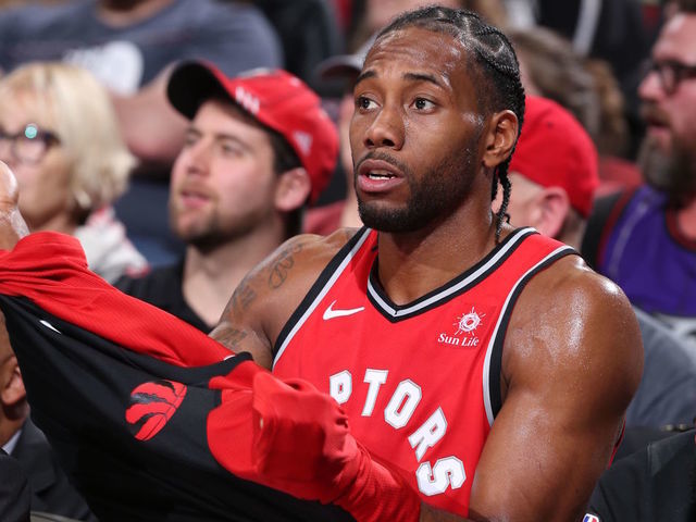 PORTLAND, OR - DECEMBER 14: Kawhi Leonard #2 of the Toronto Raptors seen on the bench during the game against the Portland Trail Blazers on December 14, 2018 at the Moda Center Arena in Portland, Oregon. Mandatory Copyright Notice: Copyright 2018 NBAE