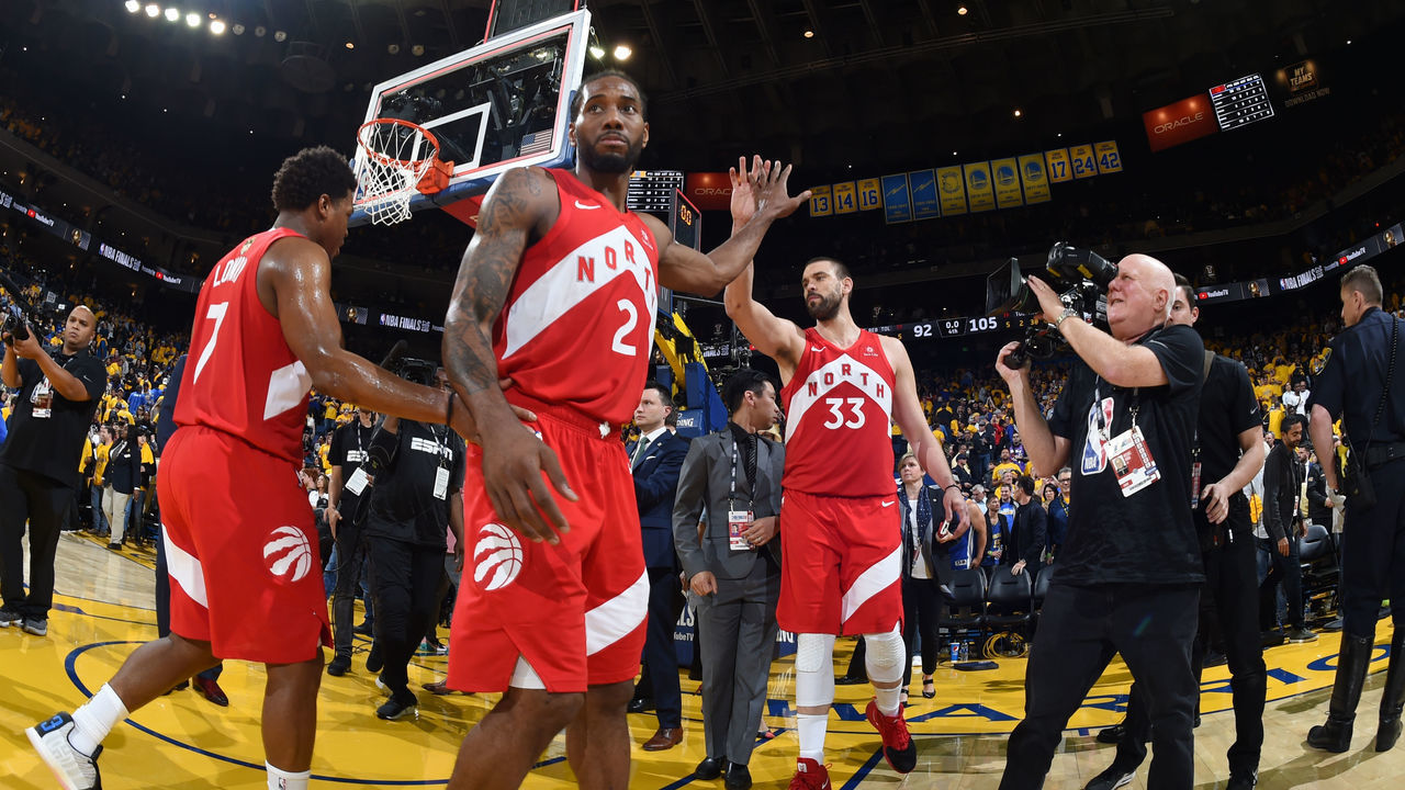 OAKLAND, CA - JUNE 7: Kawhi Leonard #2 high-fives Marc Gasol #33 of the Toronto Raptors after the game against the Golden State Warriors during Game Four of the NBA Finals on June 7, 2019 at ORACLE Arena in Oakland, California. NOTE TO USER: User expressly acknowledges and agrees that, by downloading and/or using this photograph, user is consenting to the terms and conditions of Getty Images License Agreement. Mandatory Copyright Notice: Copyright 2019 NBAE