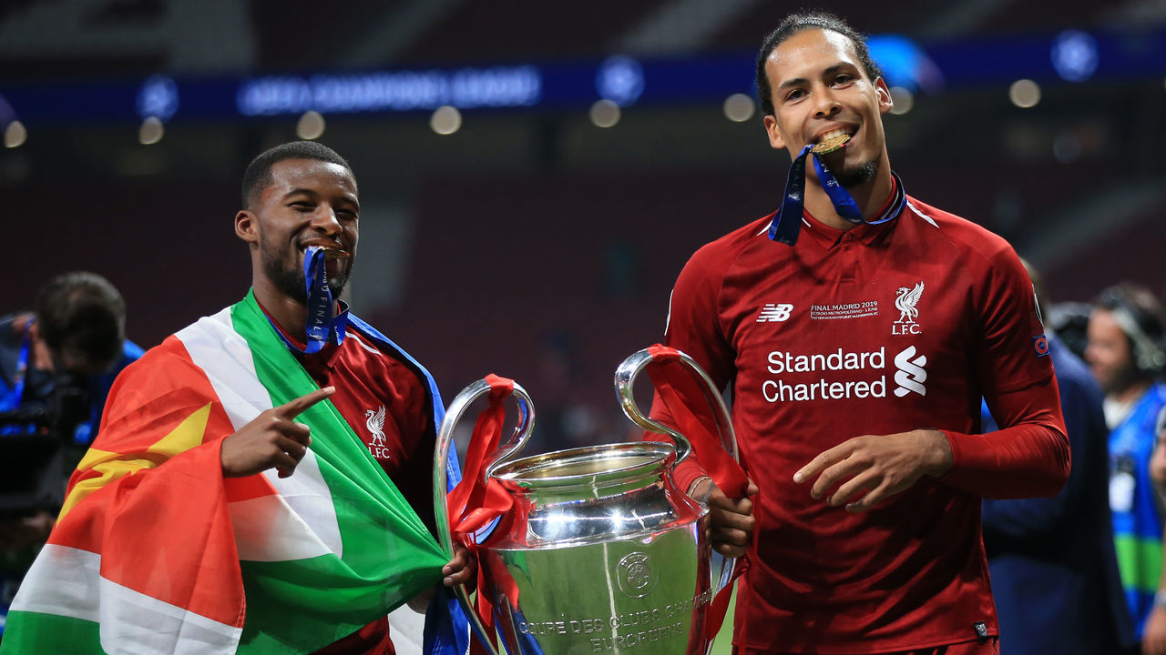 MADRID, SPAIN - JUNE 01: Georginio Wijnaldum and Virgil van Dijk of Liverpool pose with the trophy during the UEFA Champions League Final between Tottenham Hotspur and Liverpool at Estadio Wanda Metropolitano on June 1, 2019 in Madrid, Spain.