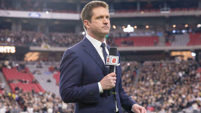 GLENDALE, AZ - JANUARY 01: ESPN sideline reporter Todd McShay reports before the college football game between the UCF Knights and the LSU Tigers on January 1, 2019 at State Farm Stadium in Glendale, Arizona.