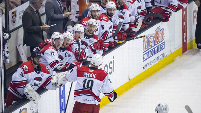 ROSEMONT, IL - JUNE 08: Charlotte Checkers center Morgan Geekie (19) celebrates his goal with the bench in the second period during game five of the AHL Calder Cup Finals between the Charlotte Checkers and the Chicago Wolves on June 8, 2019, at the Allstate Arena in Rosemont, IL.