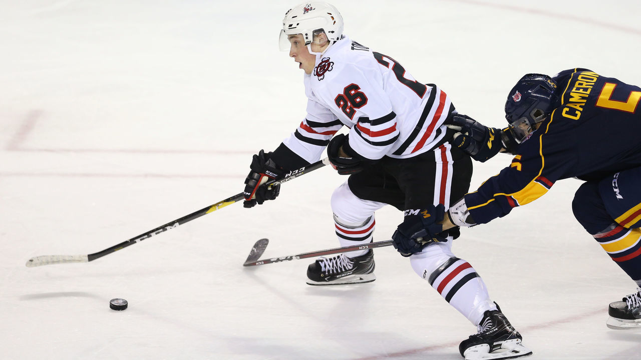 ST CATHARINES, ON - OCTOBER 11: Christopher Cameron #5 of the Barrie Colts struggles to contain Philip Tomasino #26 of the Niagara IceDogs during the first period of an OHL game at Meridian Centre on October 11, 2018 in St Catharines, Canada.