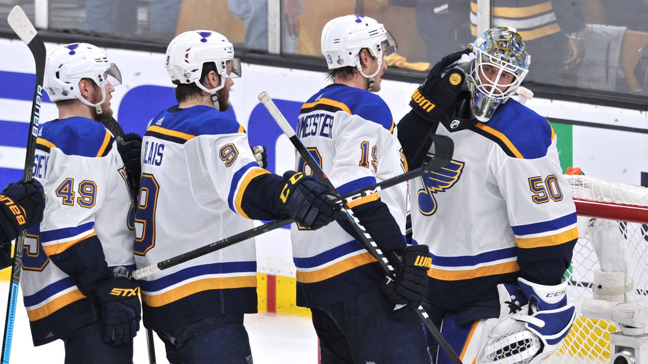BOSTON, MA - JUNE 6: St. Louis Blues defenseman Jay Bouwmeester (19) celebrates the 2 to 1 win with St. Louis Blues goaltender Jordan Binnington (50). During Game 5 of the Stanley Cup Finals featuring the St. Louis Blues against the Boston Bruins on June 6, 2019 at TD Garden in Boston, MA.