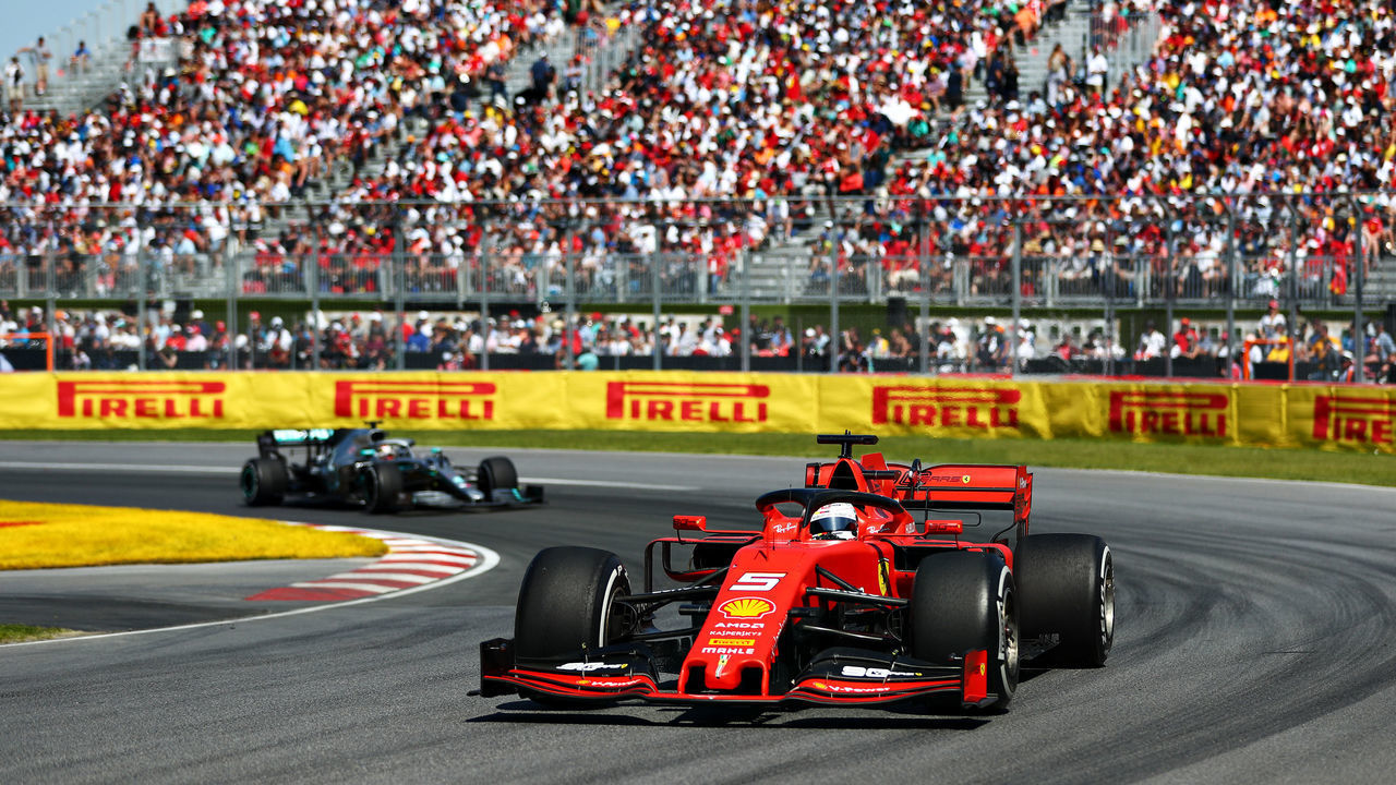MONTREAL, QUEBEC - JUNE 09: Sebastian Vettel of Germany driving the (5) Scuderia Ferrari SF90 leads Lewis Hamilton of Great Britain driving the (44) Mercedes AMG Petronas F1 Team Mercedes W10 on track during the F1 Grand Prix of Canada at Circuit Gilles Villeneuve on June 09, 2019 in Montreal, Canada.