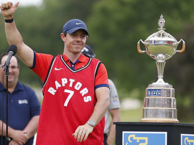 HAMILTON, ONTARIO - JUNE 09: Rory McIlroy of Northern Ireland wears a Toronto Raptors jersey after he won the RBC Canadian Open at Hamilton Golf and Country Club on June 09, 2019 in Hamilton, Canada.