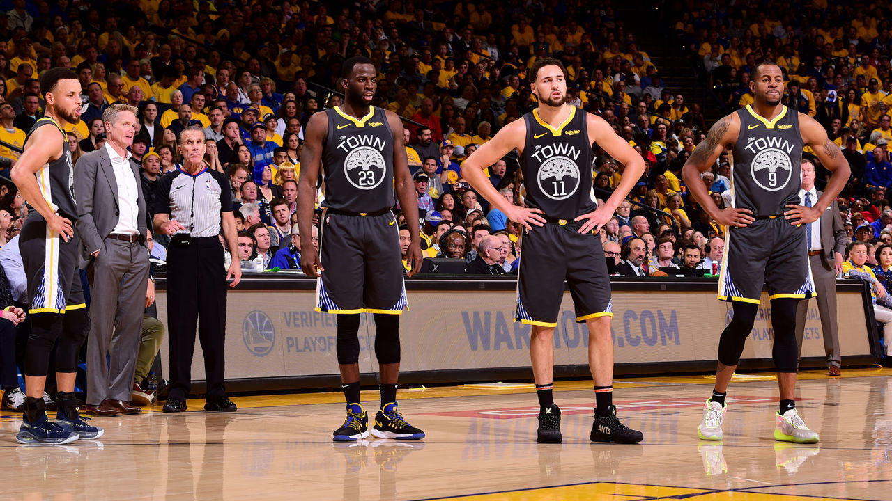 OAKLAND, CA - MAY 16: Stephen Curry #30, Draymond Green #23, Klay Thompson #11, and Andre Iguodala #9 look on during Game Two of the 2019 Western Conference Finals of the NBA Playoffs at the ORACLE Arena on May 16, 2019 in Oakland, California. Mandatory Copyright Notice: Copyright 2019 NBAE