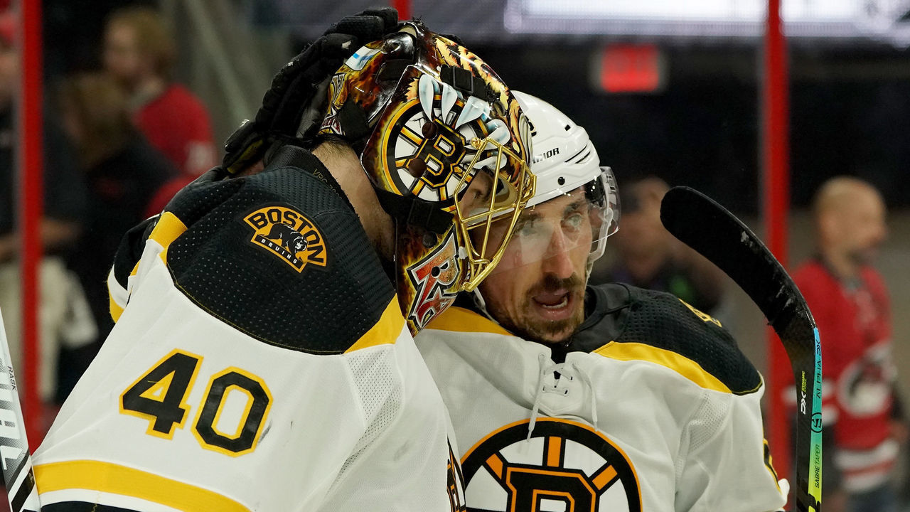 RALEIGH, NC - MAY 14: Tuukka Rask #40 of the Boston Bruins is congratulated and celebrates with teammate Brad Marchand #63 in Game Three of the Eastern Conference Third Round against the Carolina Hurricanes during the 2019 NHL Stanley Cup Playoffs on May 14, 2019 at PNC Arena in Raleigh, North Carolina.