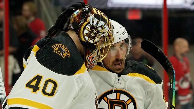 RALEIGH, NC - MAY 14: Tuukka Rask #40 of the Boston Bruins is congratulated and celebrates with teammate Brad Marchand #63 in Game Three of the Eastern Conference Third Round against the Carolina Hurricanes during the 2019 NHL Stanley Cup Playoffs on May 14, 2019 at PNC Arena in Raleigh, North Carolina.