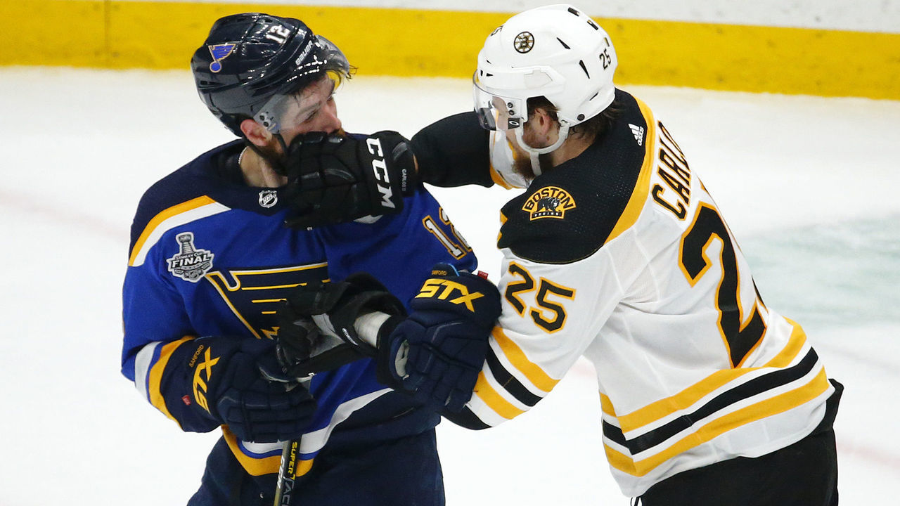 ST LOUIS, MISSOURI - JUNE 09: Zach Sanford #12 of the St. Louis Blues and Brandon Carlo #25 of the Boston Bruins mix it up during the first period in Game Six of the 2019 NHL Stanley Cup Final at Enterprise Center on June 09, 2019 in St Louis, Missouri.