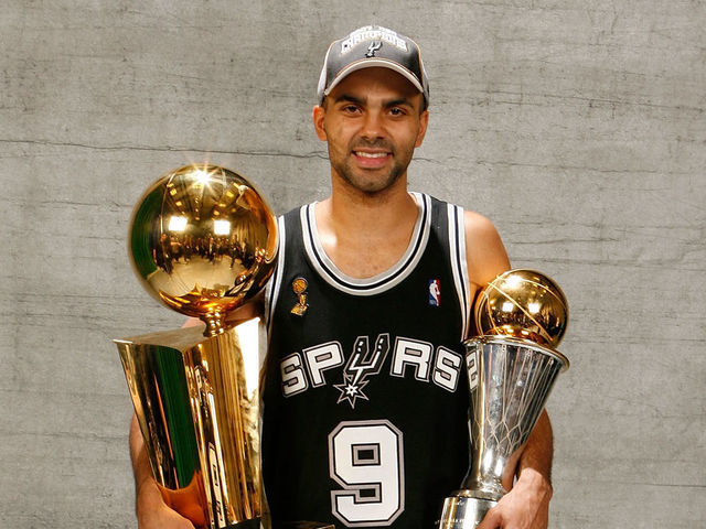 CLEVELAND - JUNE 14: Finals MVP Tony Parker #9 of the San Antonio Spurs pose for a portrait with the Larry O'Brien Championship trophy after they won the 2007 NBA Championship with their 83-82 win against the Cleveland Cavaliers in Game Four of the NBA Finals at the Quicken Loans Arena on June 14, 2007 in Cleveland, Ohio. NOTE TO USER: User expressly acknowledges and agrees that, by downloading and/or using this Photograph, user is consenting to the terms and conditions of the Getty Images License Agreement. Mandatory Copyright Notice: Copyright 2007 NBAE
