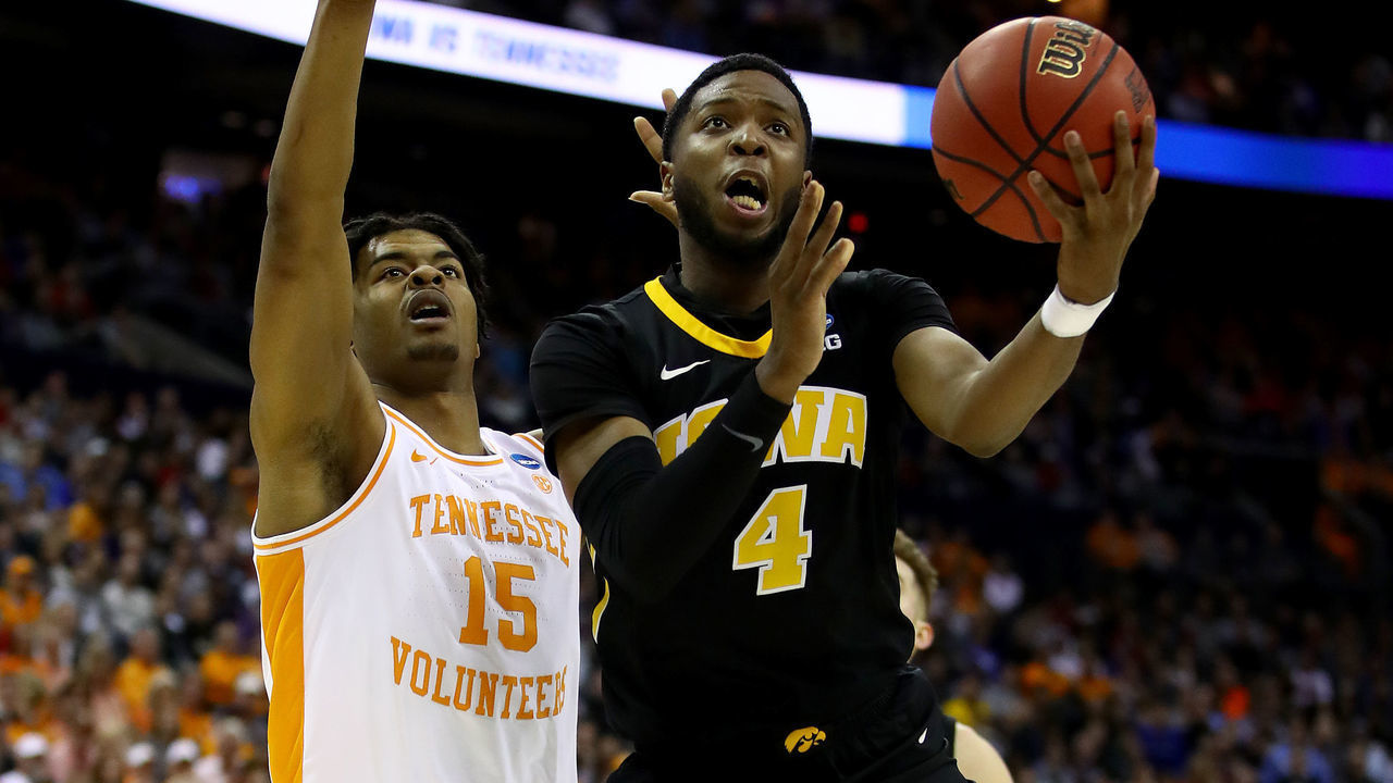 COLUMBUS, OHIO - MARCH 24: Isaiah Moss #4 of the Iowa Hawkeyes goes up for a shot against Derrick Walker #15 of the Tennessee Volunteers during their game in the Second Round of the NCAA Basketball Tournament at Nationwide Arena on March 24, 2019 in Columbus, Ohio.