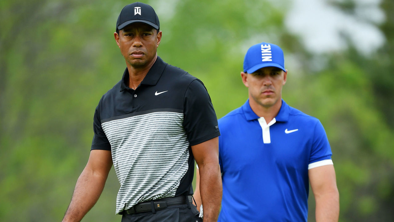 FARMINGDALE, NEW YORK - MAY 17: Tiger Woods of the United States and Brooks Koepka of the United States walk along the course during the second round of the 2019 PGA Championship at the Bethpage Black course on May 17, 2019 in Farmingdale, New York.
