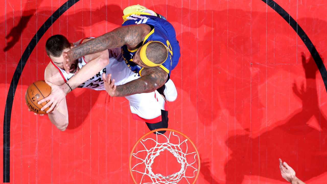 TORONTO, CANADA - JUNE 10: Marc Gasol #33 of the Toronto Raptors shoots the ball against DeMarcus Cousins #0 of the Golden State Warriors during Game Five of the NBA Finals on June 10, 2019 at Scotiabank Arena in Toronto, Ontario, Canada. NOTE TO USER: User expressly acknowledges and agrees that, by downloading and/or using this photograph, user is consenting to the terms and conditions of the Getty Images License Agreement. Mandatory Copyright Notice: Copyright 2019 NBAE