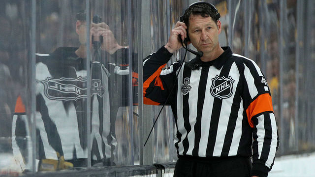 BOSTON, MASSACHUSETTS - JUNE 06: Referee Steve Kozari #40 officiates Game Five of the 2019 NHL Stanley Cup Final between the Boston Bruins and the St. Louis Blues at TD Garden on June 06, 2019 in Boston, Massachusetts.