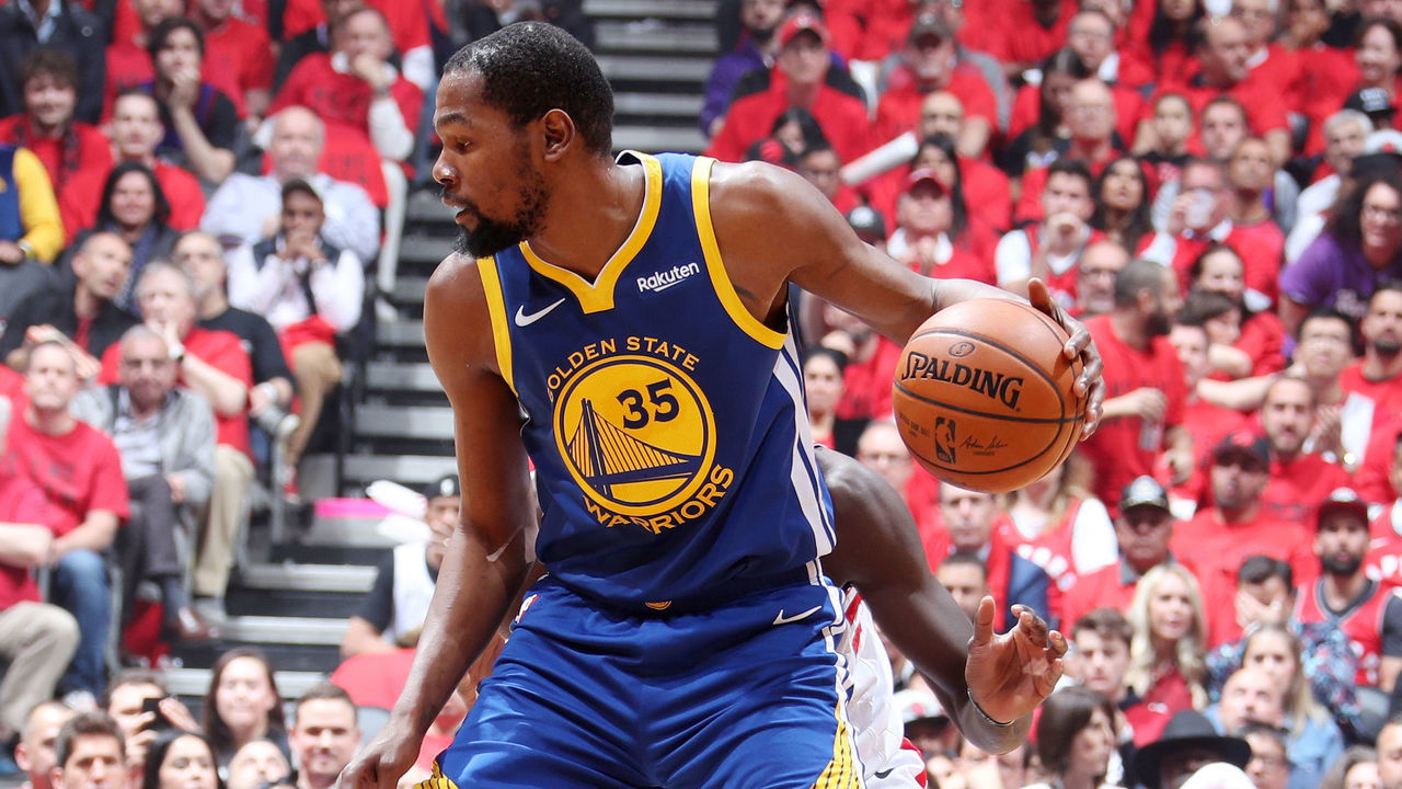 TORONTO, CANADA - JUNE 10: Kevin Durant #35 of the Golden State Warriors handles the ball against the Toronto Raptors during Game Five of the NBA Finals on June 10, 2019 at Scotiabank Arena in Toronto, Ontario, Canada. NOTE TO USER: User expressly acknowledges and agrees that, by downloading and/or using this photograph, user is consenting to the terms and conditions of the Getty Images License Agreement. Mandatory Copyright Notice: Copyright 2019 NBAE