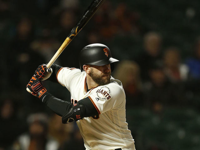 Buster Posey tried to slide headfirst into third base, but the bag won