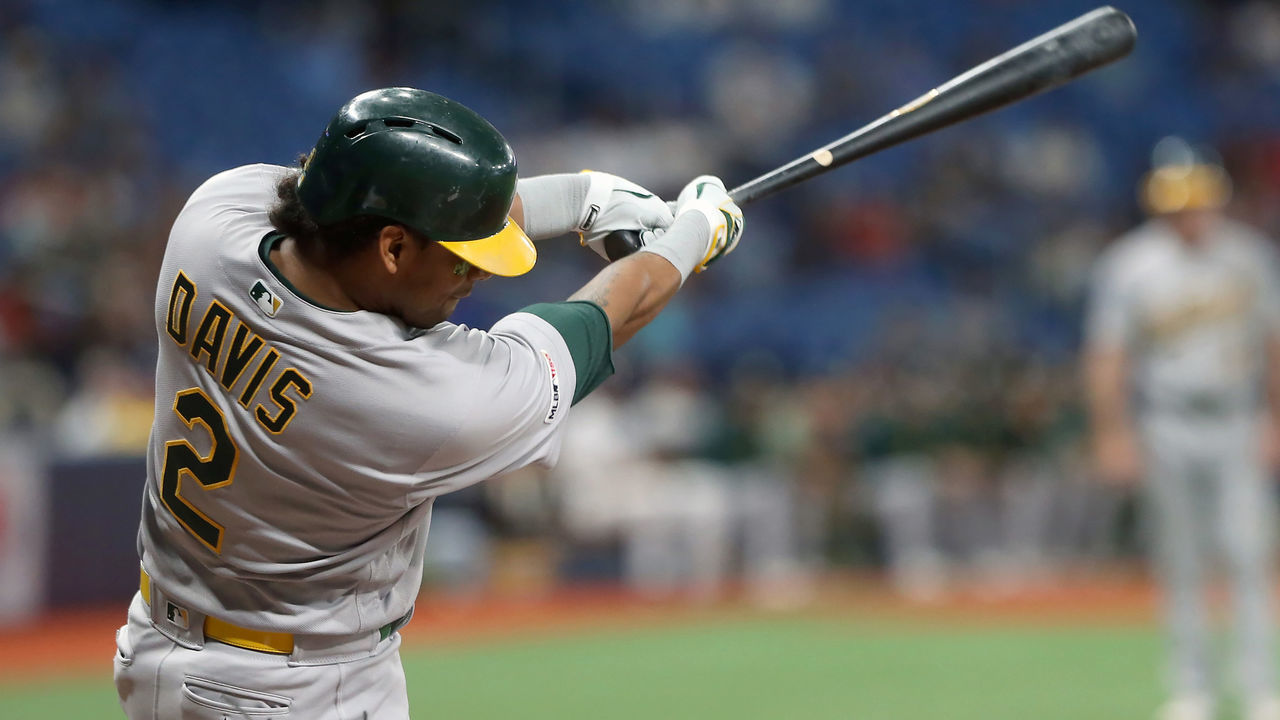 ST. PETERSBURG, FL - JUN 11: Khris Davis (2) of the Athletics drives this pitch over the fence for a home run during the MLB regular season game between the Oakland Athletics and the Tampa Bay Rays on June 11, 2019, at Tropicana Field in St. Petersburg, FL.