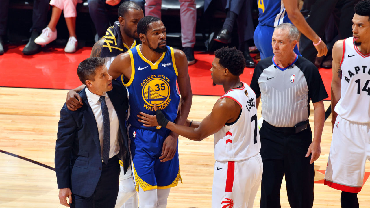 TORONTO, CANADA - JUNE 10: Kevin Durant #35 of the Golden State Warriors reacts to his leg injury during a game against the Toronto Raptors during Game Five of the NBA Finals on June 10, 2019 at Scotiabank Arena in Toronto, Ontario, Canada. NOTE TO USER: User expressly acknowledges and agrees that, by downloading and/or using this photograph, user is consenting to the terms and conditions of the Getty Images License Agreement. Mandatory Copyright Notice: Copyright 2019 NBAE