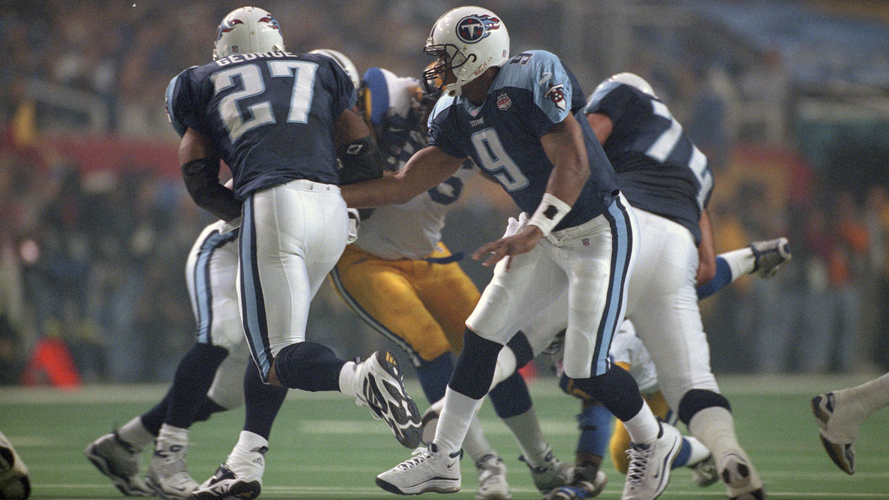 ATLANTA, GA - JANUARY 30: Steve McNair #9 of the Tennessee Titans turns to hand the ball off to Eddie George #27 against the St. Louis Rams during Super Bowl XXXIV at the Georgia Dome on January 30, 2000 in Atlanta, Georgia. The Ram won the game 23-16.