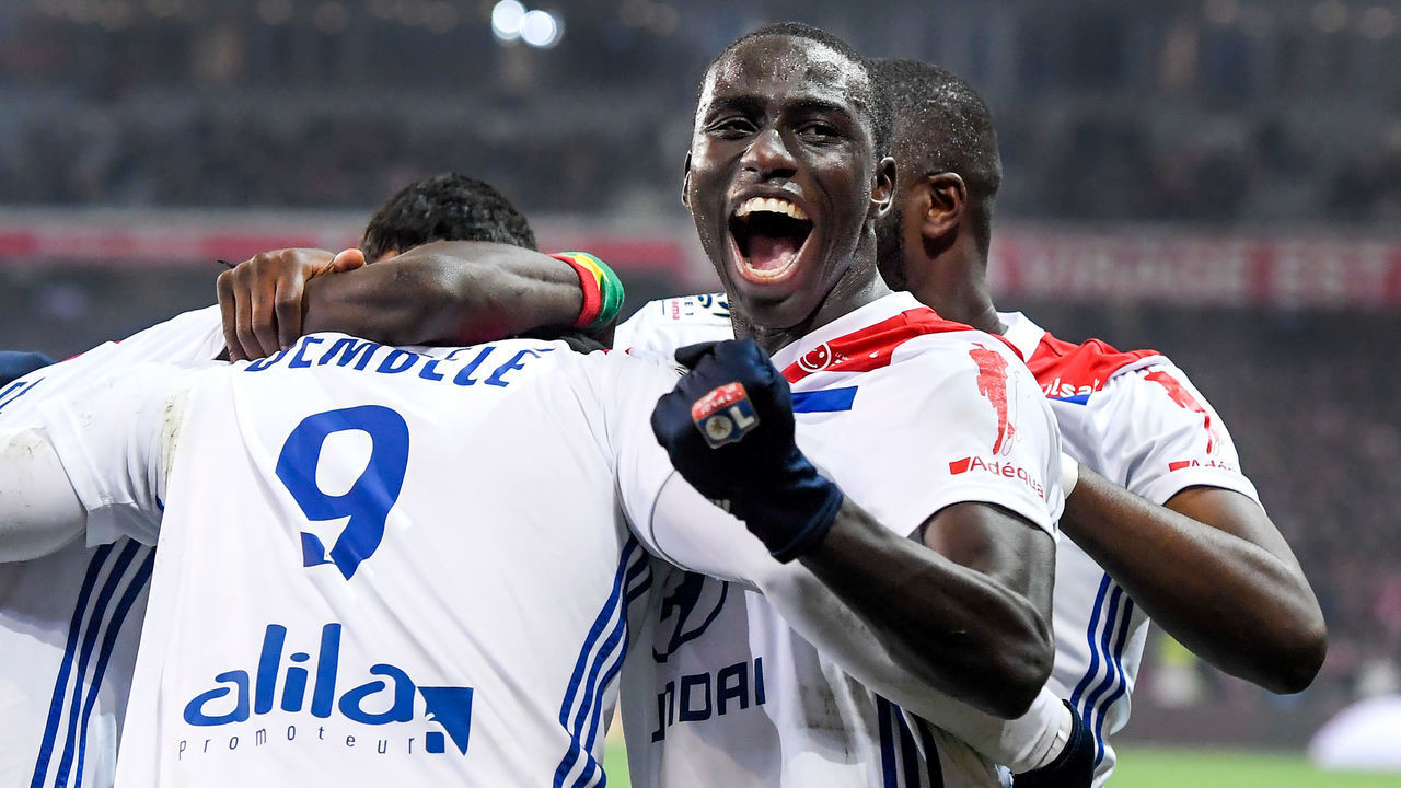 LILLE, FRANCE - DECEMBER 1: Ferland Mendy of Olympique Lyon celebrate 2-2 with Moussa Dembele of Olympique Lyon during the French League 1 match between Lille v Olympique Lyon at the Stade Pierre Mauroy on December 1, 2018 in Lille France