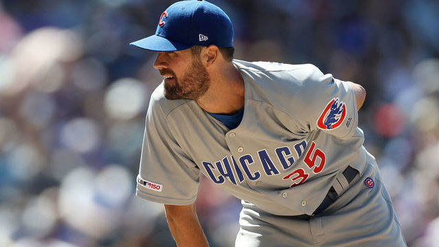 DENVER, COLORADO - JUNE 12: Starting pitcher Cole Hamels #35 of the Chicago Cubs throws in the seventh inning against the Colorado Rockies at Coors Field on June 12, 2019 in Denver, Colorado.