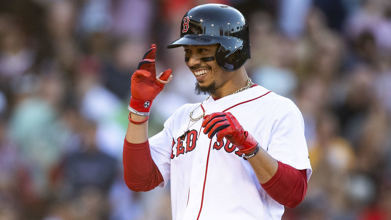 BOSTON, MA - JUNE 12: Mookie Betts #50 of the Boston Red Sox reacts after being walked to force in the game winning run on a walk off during the ninth inning of a game against the Texas Rangers on June 12, 2019 at Fenway Park in Boston, Massachusetts.