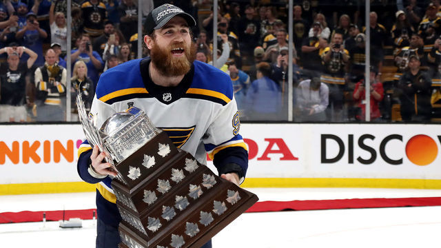 BOSTON, MASSACHUSETTS - JUNE 12: Ryan O'Reilly #90 of the St. Louis Blues celebrates with the Conn Smythe Trophy after defeating the Boston Bruins 4-1 to win Game Seven of the 2019 NHL Stanley Cup Final at TD Garden on June 12, 2019 in Boston, Massachusetts.