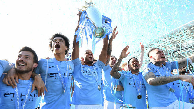 BRIGHTON, ENGLAND - MAY 12: Vincent Kompany of Manchester City lifts the Premier League Trophy after winning the title during the Premier League match between Brighton & Hove Albion and Manchester City at American Express Community Stadium on May 12, 2019 in Brighton, United Kingdom.