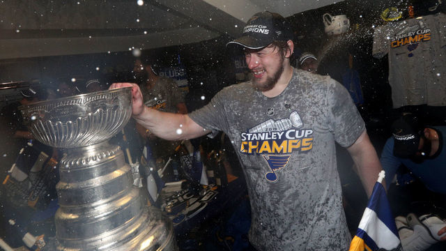 BOSTON, MASSACHUSETTS - JUNE 12: Vladimir Tarasenko #91 of the St. Louis Blues and his teammates celebrate with the Stanley Cup in the locker room after the 2019 NHL Stanley Cup Final at TD Garden on June 12, 2019 in Boston, Massachusetts. The St. Louis Blues defeated the Boston Bruins 4-1 in Game 7 to win the Stanley Cup Final 4-3.