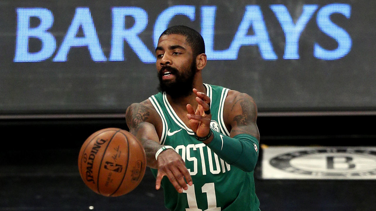 NEW YORK, NY - JANUARY 6: Kyrie Irving #11 of the Boston Celtics passes in an NBA basketball game against the Brooklyn Nets on January 6, 2018 at Barclays Center in the Brooklyn borough of New York City. Celtics won 87-85. NOTE TO USER: User expressly acknowledges and agrees that, by downloading and/or using this Photograph, user is consenting to the terms and conditions of the Getty Images License Agreement.