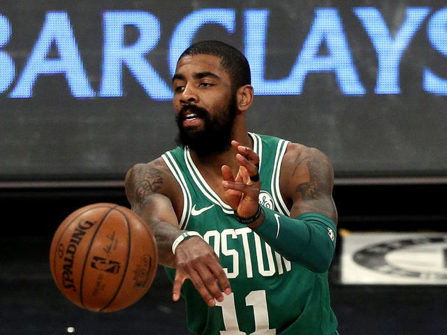 NEW YORK, NY - JANUARY 6: Kyrie Irving #11 of the Boston Celtics passes in an NBA basketball game against the Brooklyn Nets on January 6, 2018 at Barclays Center in the Brooklyn borough of New York City. Celtics won 87-85. NOTE TO USER: User expressly acknowledges and agrees that, by downloading and/or using this Photograph, user is consenting to the terms and conditions of the Getty Images License Agreement.