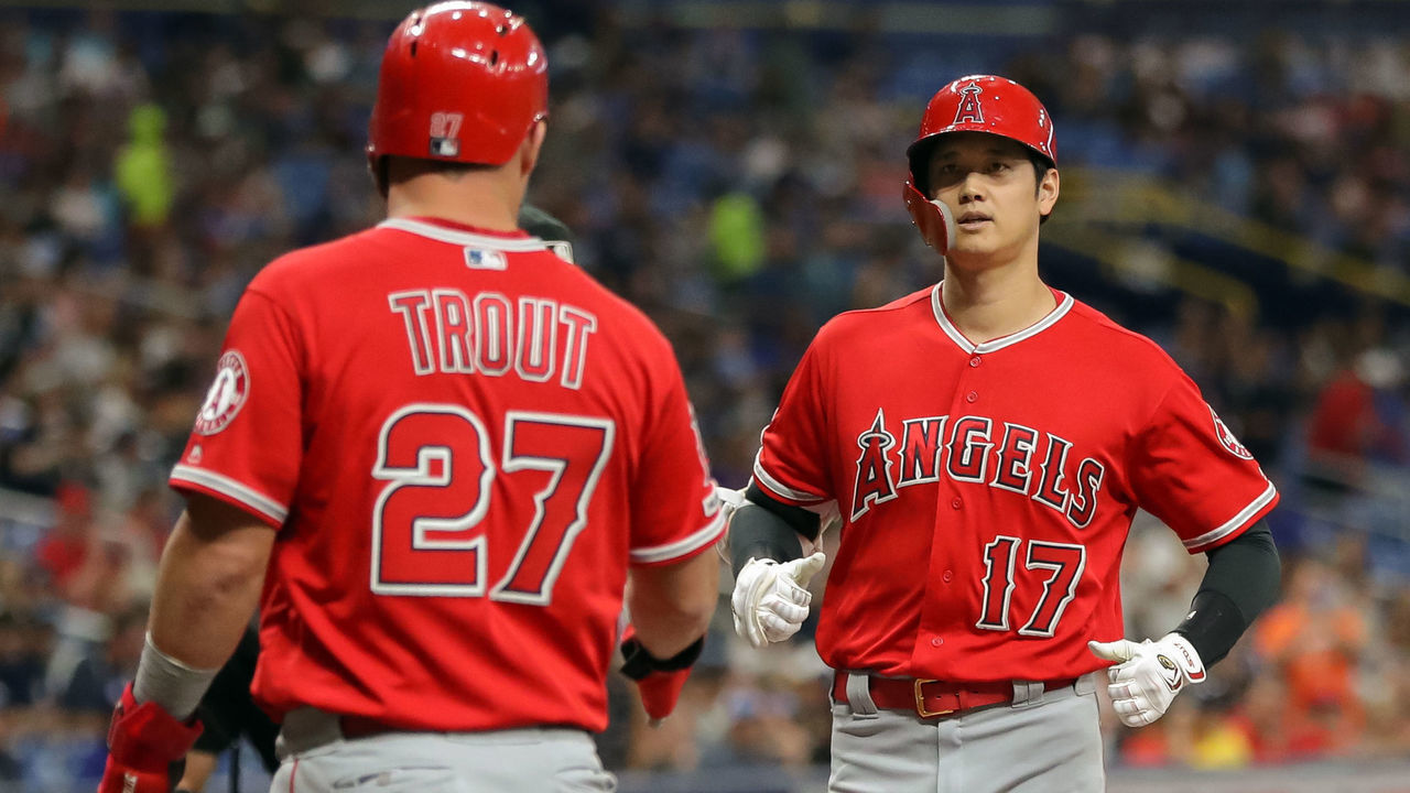 ST. PETERSBURG, FL - JUNE 13: Shohei Ohtani #17 of the Los Angeles Angels is greeted by Mike Trout #27 after his three-run home run in the first inning of a baseball game against the Tampa Bay Rays at Tropicana Field on June 13, 2019 in St. Petersburg, Florida.