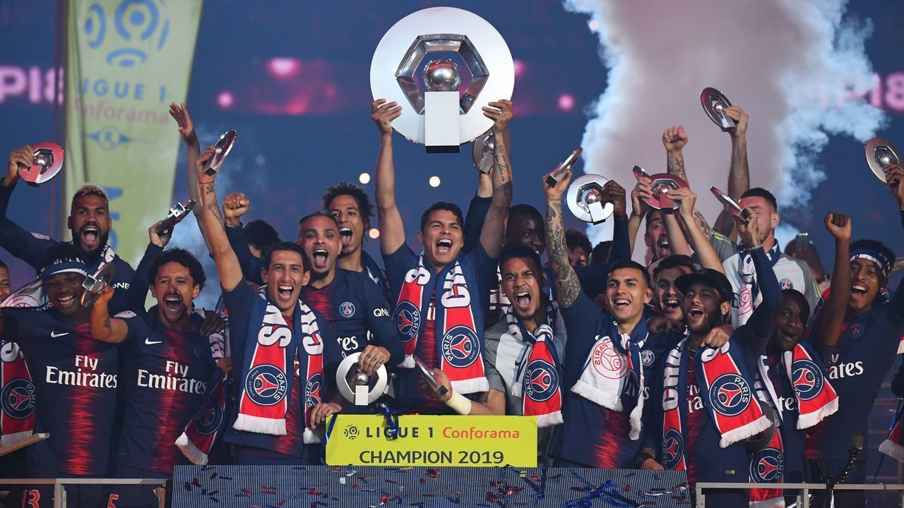 Paris Saint-Germain's Brazilian defender Thiago Silva lifts up the Champion's trophy at the end of the French L1 football match between Paris Saint-Germain (PSG) and Dijon at the Parc des Princes stadium in Paris on May 18, 2019.