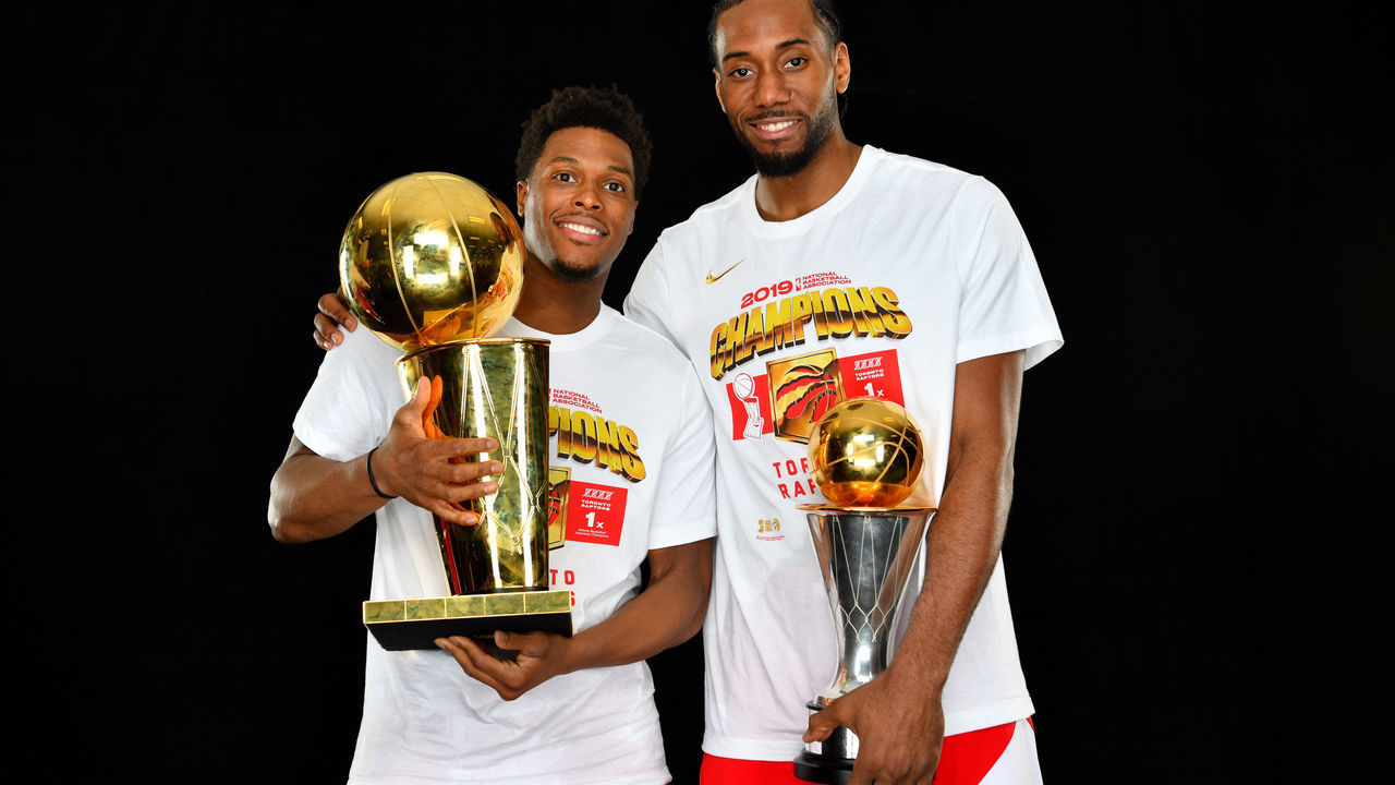 OAKLAND, CA - JUNE 13: Kyle Lowry #7 and Kawhi Leonard #2 of the Toronto Raptors pose for a portrait with the Larry O'Brien Trophy after winning Game Six of the 2019 NBA Finals against the Golden State Warriors on June 13, 2019 at ORACLE Arena in Oakland, California. NOTE TO USER: User expressly acknowledges and agrees that, by downloading and/or using this photograph, user is consenting to the terms and conditions of Getty Images License Agreement. Mandatory Copyright Notice: Copyright 2019 NBAE