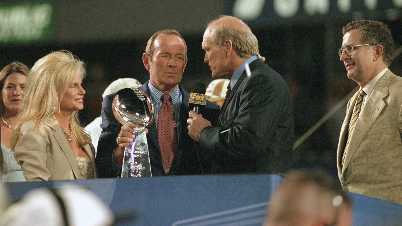 MIAMI, FL - JANUARY 31: Pat Bowlen owner of the Denver Broncos holding the Lombardi Trophy and talking with Fox Football analyst Terry Bradshaw after the Broncos defeated the Atlanta Falcons in Super Bowl XXXIII January 31, 1999 at Pro Player Stadium in Miami, Florida . The Broncos won the game 35-19.