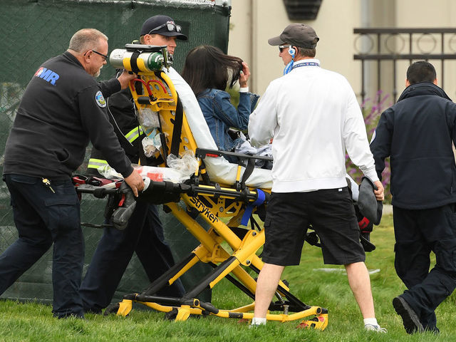 PEBBLE BEACH, CALIFORNIA - JUNE 14: Medical attention is administered after an incident involving a golf cart on the 16th hole during the second round of the 2019 U.S. Open at Pebble Beach Golf Links on June 14, 2019 in Pebble Beach, California.