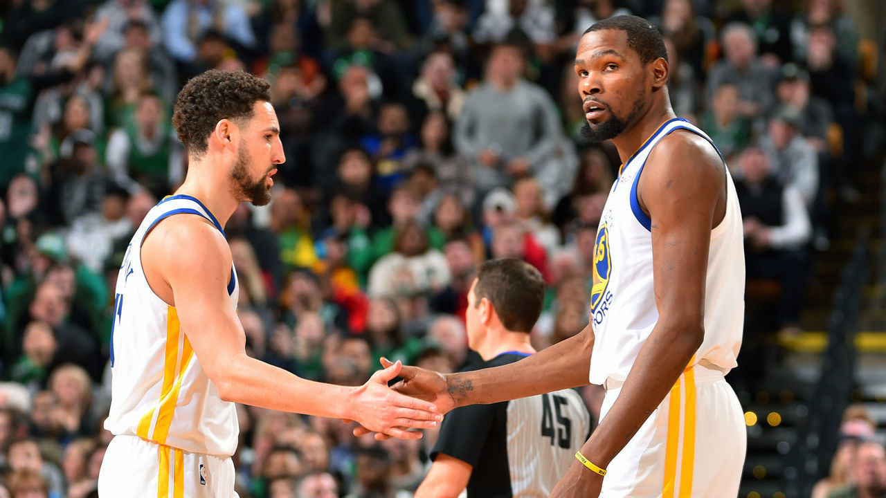 BOSTON, MA - JANUARY 26: Klay Thompson #11 and Kevin Durant #35 of the Golden State Warriors high five during the game against the Boston Celtics on January 26, 2019 at the TD Garden in Boston, Massachusetts. NOTE TO USER: User expressly acknowledges and agrees that, by downloading and/or using this photograph, user is consenting to the terms and conditions of the Getty Images License Agreement. Mandatory Copyright Notice: Copyright 2019 NBAE