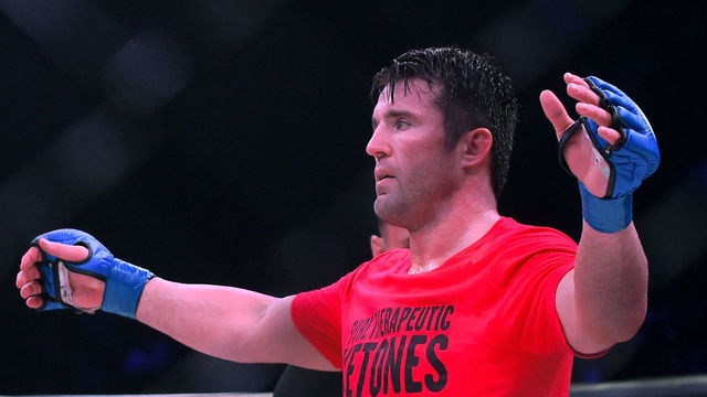 INGLEWOOD, CA - JANUARY 20: Referee Mike Beltran raises the arm of Chael Sonnen (blue gloves) as he defeated Quinton Jackson (not pictured) in their Heavyweight World Title fight at Bellator 192 at The Forum on January 20, 2018 in Inglewood, California.