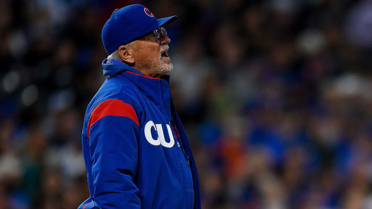 DENVER, CO - JUNE 11: Chicago Cubs manager Joe Maddon (70) walks onto the field to make a pitching change against the Colorado Rockies during a regular season Major League Baseball game at Coors Field in Denver, Colorado.