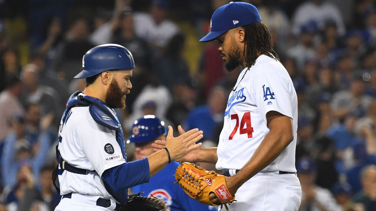 LOS ANGELES, CA - JUNE 14: Kenley Jansen #74 shakes hands with Russell Martin #55 of the Los Angeles Dodgers after earning a save in the ninth inning of the game against the Chicago Cubs at Dodger Stadium on June 14, 2019 in Los Angeles, California.