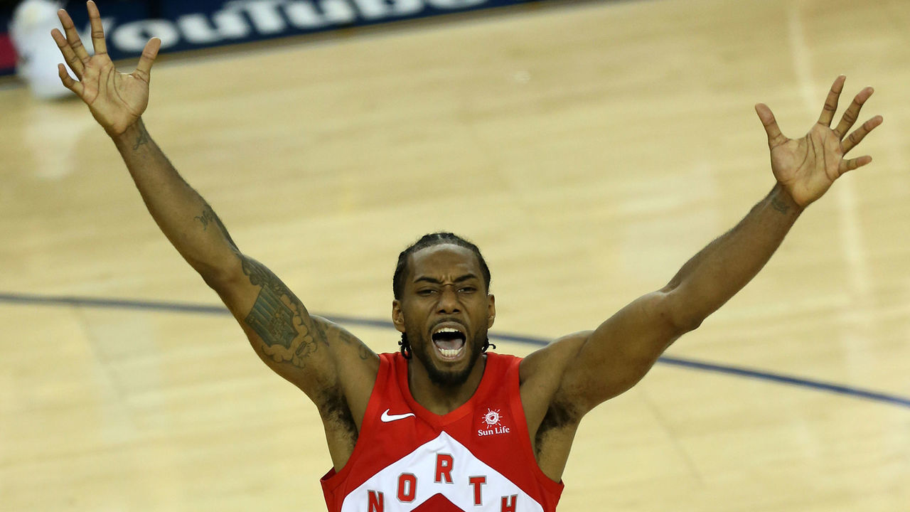 OAKLAND, CA - JUNE 13: Kawhi Leonard of the Toronto Raptors celebrates an NBA Championship at the conclusion of Toronto's 114-110 win over the Golden State Warriors in Game 6 of the 2019 NBA Finals on June 13, 2019 at Oracle Arena in Oakland, CA.