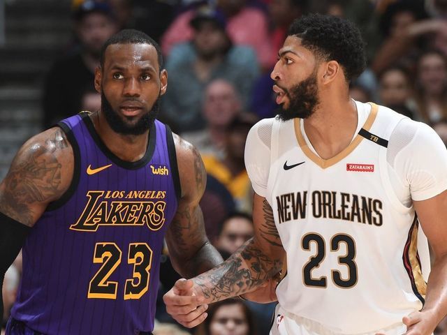 LOS ANGELES, CA - DECEMBER 21: LeBron James #23 of the Los Angeles Lakers and Anthony Davis #23 of the New Orleans Pelicans fight for position during a game on December 21, 2018 at STAPLES Center in Los Angeles, California. NOTE TO USER: User expressly acknowledges and agrees that, by downloading and/or using this Photograph, user is consenting to the terms and conditions of the Getty Images License Agreement. Mandatory Copyright Notice: Copyright 2018 NBAE