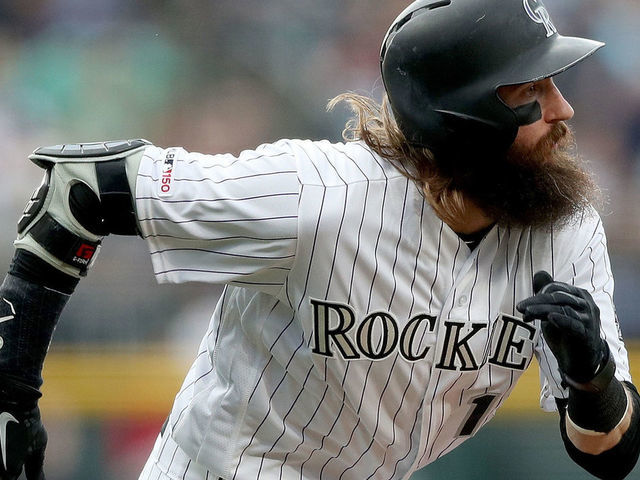 DENVER, COLORADO - JUNE 15: Charlie Blackmon #19 of the Colorado Rockies scores on a David Dahl sacrifice in the first inning against the San Diego Padres at Coors Field on June 15, 2019 in Denver, Colorado.