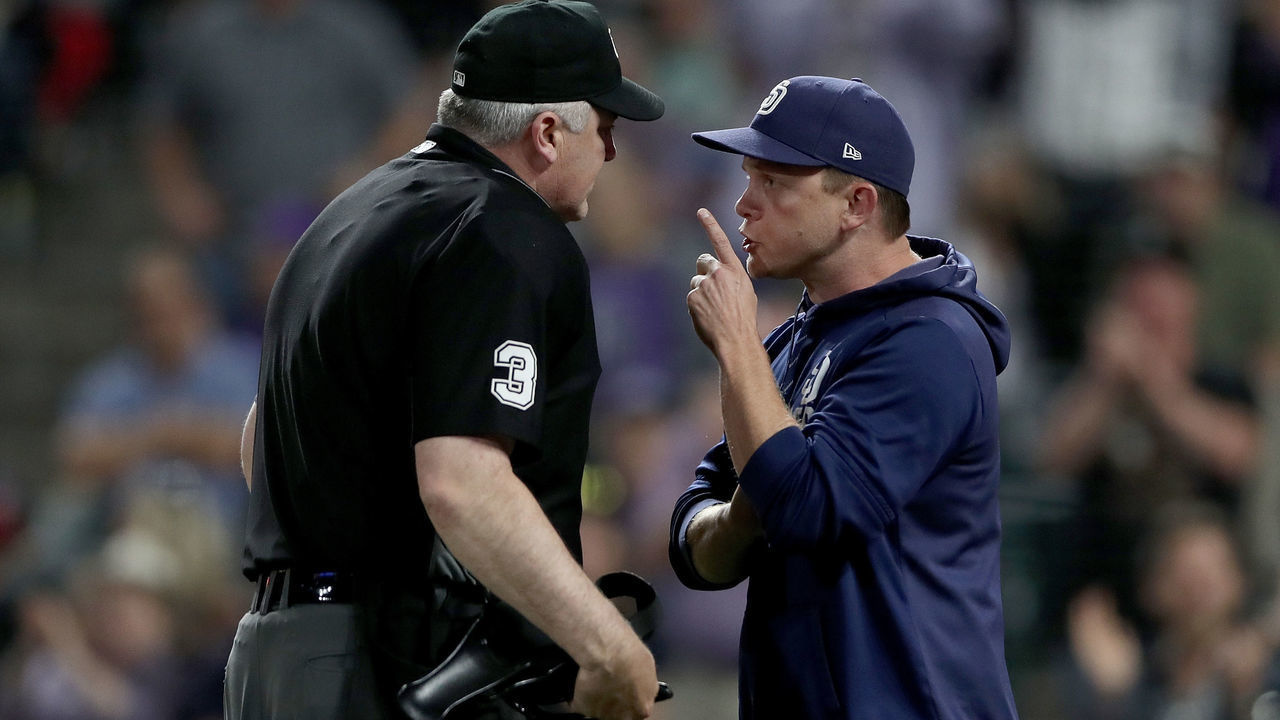 DENVER, COLORADO - JUNE 15: Manager Andy Green of the San Diego Padres argues with home plate umpire Bill Welke #3 before being ejected in the sixth inning against the Colorado Rockies at Coors Field on June 15, 2019 in Denver, Colorado.